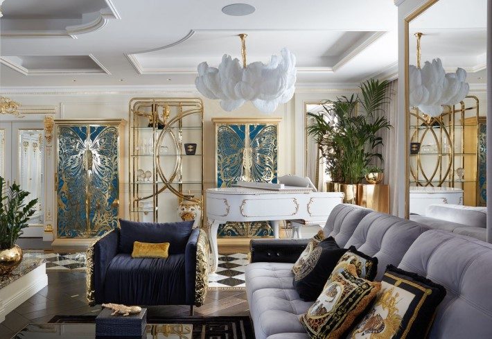 Teal Mademoiselle butterfly armoires in a living room by Tatyana Mironova Design